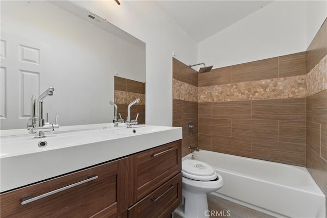 full bath with washtub / shower combination, visible vents, a sink, toilet, and double vanity
