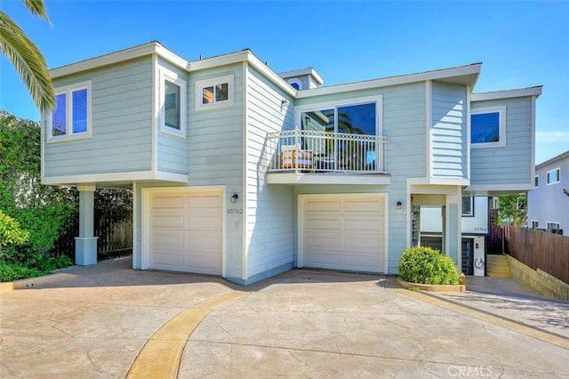 33762 Orilla Rd, Dana Point, CA 92629 - view of front of home with a balcony, a garage, concrete driveway, and fence