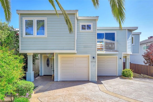 33762 Orilla Rd, Dana Point, CA 92629 - view of front of house featuring driveway, an attached garage, and fence