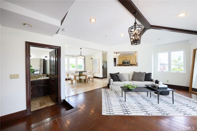 33762 Orilla Rd, Dana Point, CA 92629 - living room with a chandelier, dark wood finished floors, baseboards, and lofted ceiling
