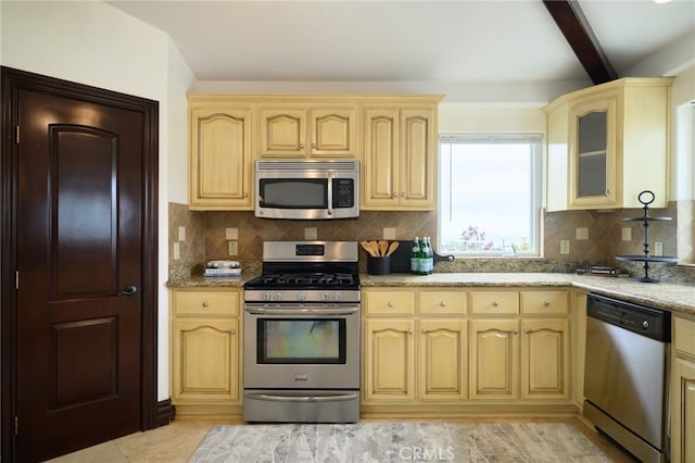 33762 Orilla Rd, Dana Point, CA 92629 - kitchen featuring stainless steel appliances, decorative backsplash, light stone counters, glass insert cabinets, and beamed ceiling