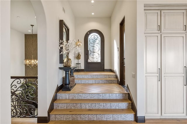 121 Avenida Pizarro, San Clemente, CA 92672 - doorway to outside featuring arched walkways, stairs, baseboards, a chandelier, and recessed lighting
