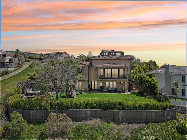121 Avenida Pizarro, San Clemente, CA 92672 - rear view of house with a playground, stucco siding, a balcony, and a tile roof