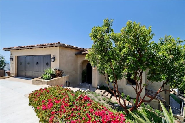 121 Avenida Pizarro, San Clemente, CA 92672 - mediterranean / spanish home with concrete driveway, stucco siding, and an attached garage
