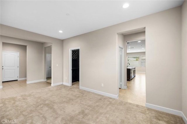 45600 Gresham, Temecula, CA 92592 - unfurnished room featuring light carpet, baseboards, recessed lighting, and a sink