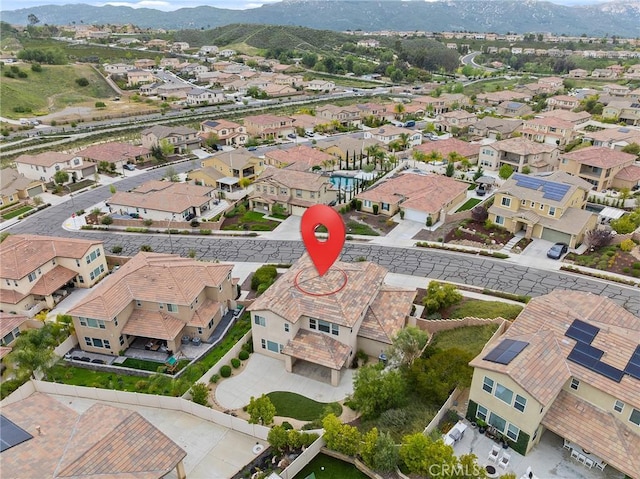 drone / aerial view featuring a mountain view and a residential view