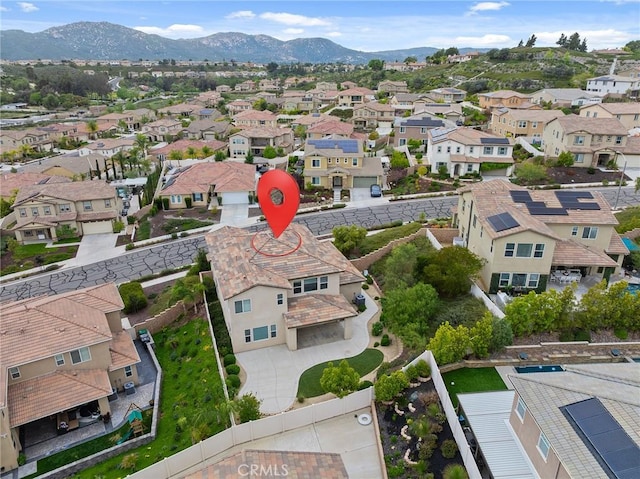 birds eye view of property featuring a mountain view and a residential view