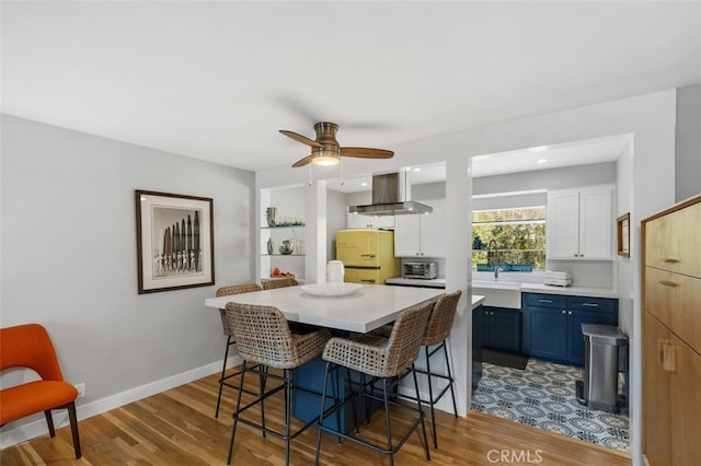 dining area featuring dark wood-type flooring, ceiling fan, baseboards, and recessed lighting