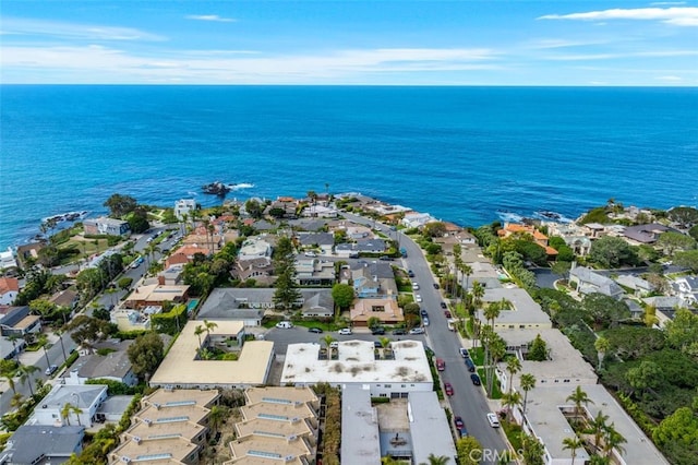 aerial perspective of suburban area featuring a nearby body of water