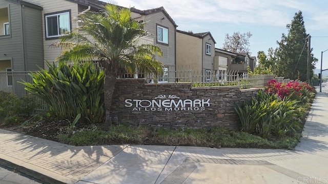 community sign with fence