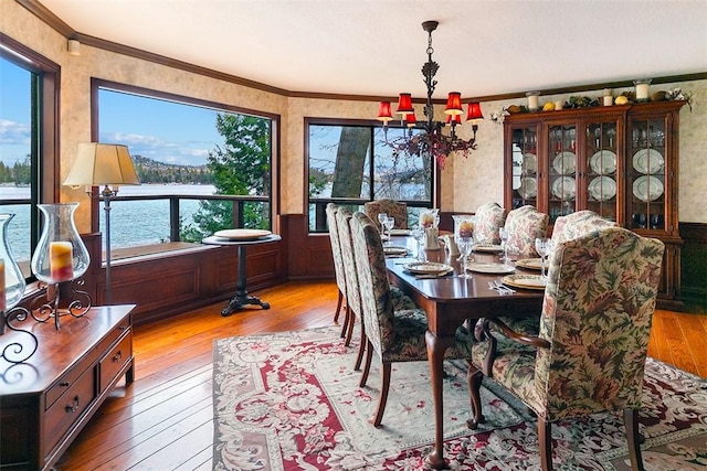 27990 Peninsula Dr N, Lake Arrowhead, CA 92352 - dining room with a chandelier, wood-type flooring, wainscoting, and ornamental molding