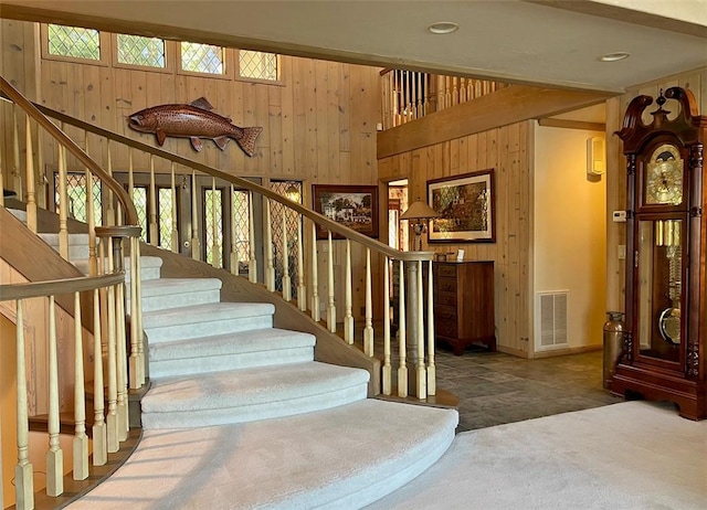 27990 Peninsula Dr N, Lake Arrowhead, CA 92352 - stairway with wooden walls, visible vents, and carpet floors