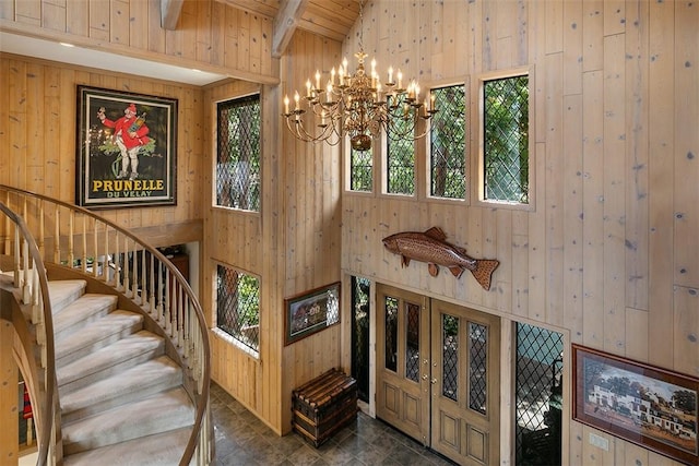27990 Peninsula Dr N, Lake Arrowhead, CA 92352 - stairway with wood walls, vaulted ceiling with beams, wooden ceiling, and an inviting chandelier