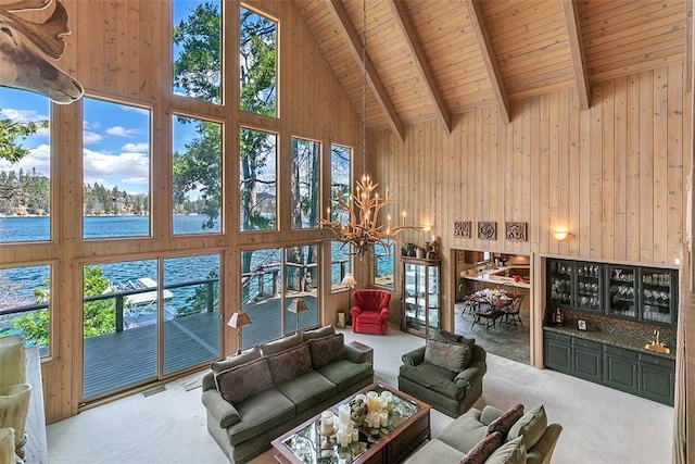 27990 Peninsula Dr N, Lake Arrowhead, CA 92352 - living room with high vaulted ceiling, carpet flooring, beamed ceiling, and wooden walls