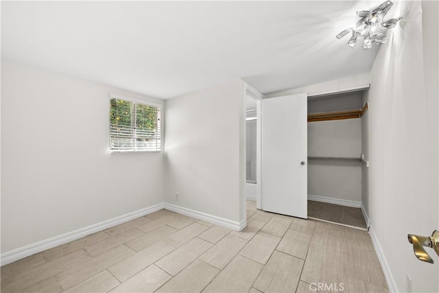 5025 Noble Ave, Sherman Oaks, CA 91403 - unfurnished bedroom with baseboards, wood finished floors, and a closet