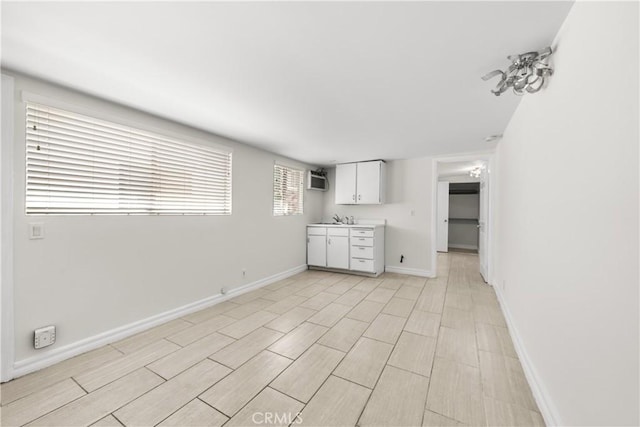 5025 Noble Ave, Sherman Oaks, CA 91403 - kitchen featuring light countertops, white cabinets, and baseboards