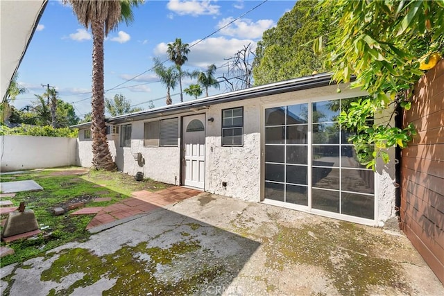 5025 Noble Ave, Sherman Oaks, CA 91403 - rear view of house featuring stucco siding and a patio