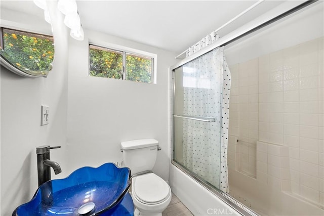 5025 Noble Ave, Sherman Oaks, CA 91403 - full bath featuring combined bath / shower with glass door, toilet, and wood finished floors