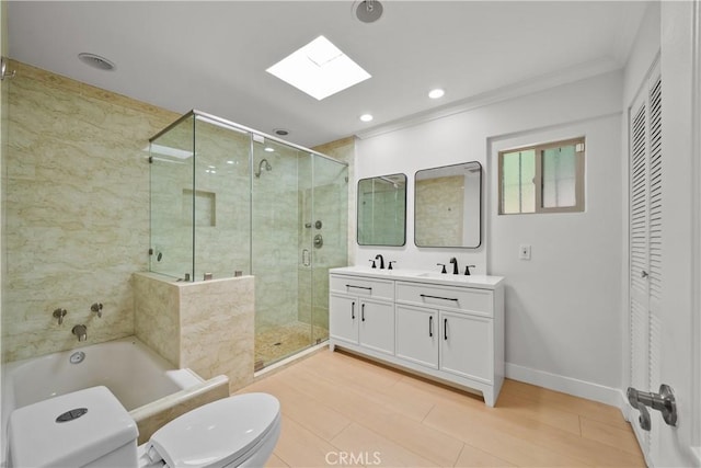 5025 Noble Ave, Sherman Oaks, CA 91403 - full bathroom with toilet, a garden tub, a skylight, a stall shower, and double vanity