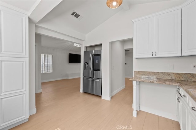 5025 Noble Ave, Sherman Oaks, CA 91403 - kitchen with stainless steel refrigerator with ice dispenser, white cabinets, light wood-type flooring, light stone countertops, and baseboards