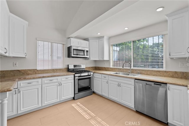 5025 Noble Ave, Sherman Oaks, CA 91403 - kitchen featuring appliances with stainless steel finishes, a sink, white cabinets, light countertops, and recessed lighting