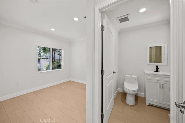 5025 Noble Ave, Sherman Oaks, CA 91403 - bathroom featuring crown molding, vanity, toilet, wood finished floors, and recessed lighting