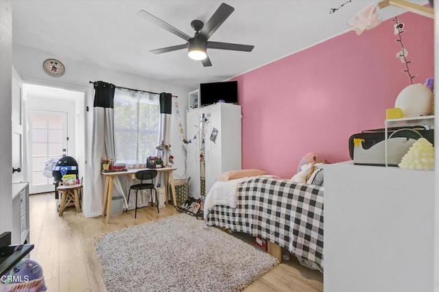 bedroom featuring a ceiling fan and wood finished floors
