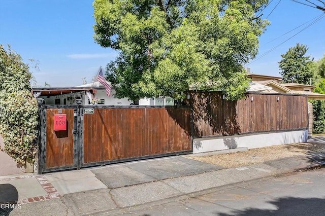 view of gate featuring fence