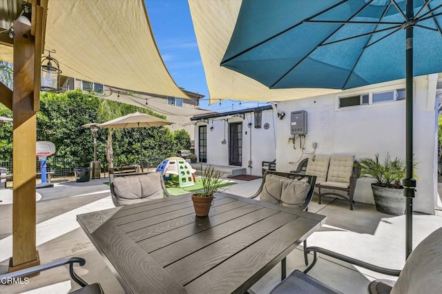 view of patio featuring outdoor dining area