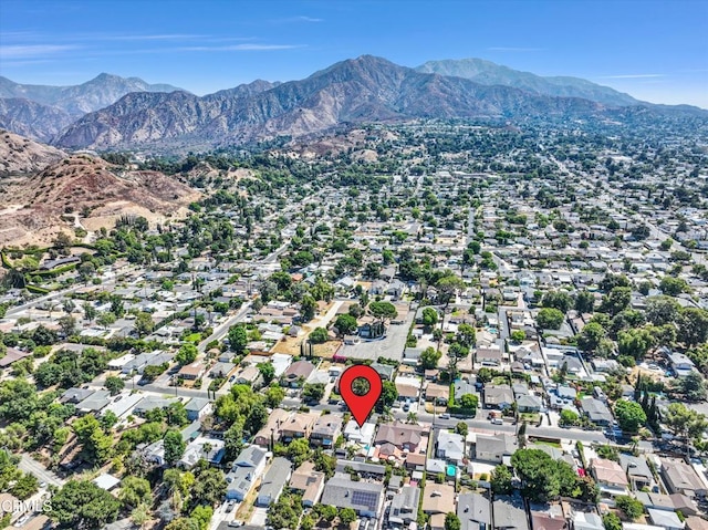 birds eye view of property with a residential view and a mountain view