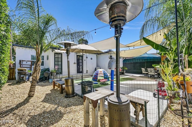 view of patio / terrace with grilling area and fence