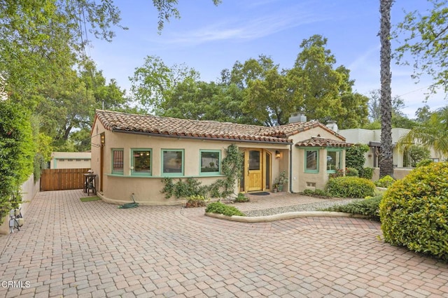 308 Topa Topa Dr, Ojai, CA 93023 - view of front of house featuring a tiled roof, stucco siding, and fence