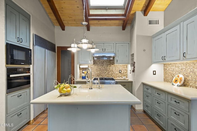 308 Topa Topa Dr, Ojai, CA 93023 - kitchen with visible vents, under cabinet range hood, light countertops, a sink, and built in appliances