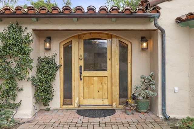 308 Topa Topa Dr, Ojai, CA 93023 - view of exterior entry featuring stucco siding and a tile roof