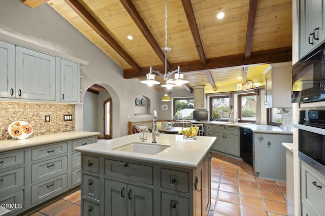 308 Topa Topa Dr, Ojai, CA 93023 - kitchen featuring arched walkways, black appliances, a sink, vaulted ceiling with beams, and backsplash