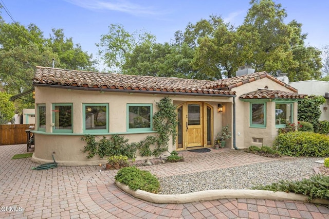 308 Topa Topa Dr, Ojai, CA 93023 - mediterranean / spanish house featuring a tiled roof, stucco siding, fence, and a chimney