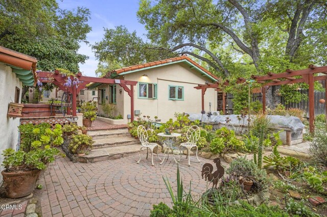 308 Topa Topa Dr, Ojai, CA 93023 - rear view of property featuring stucco siding, a patio, a pergola, and a tiled roof
