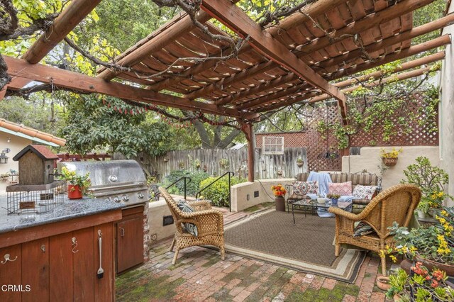 308 Topa Topa Dr, Ojai, CA 93023 - fenced backyard with outdoor lounge area, a pergola, a patio, and area for grilling