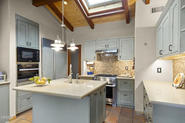 308 Topa Topa Dr, Ojai, CA 93023 - kitchen featuring stainless steel appliances, a skylight, tile patterned flooring, tasteful backsplash, and wood ceiling