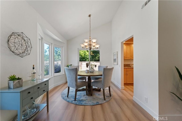 43 Ashbrook, Irvine, CA 92604 - dining space featuring light wood-style floors, a notable chandelier, baseboards, and visible vents