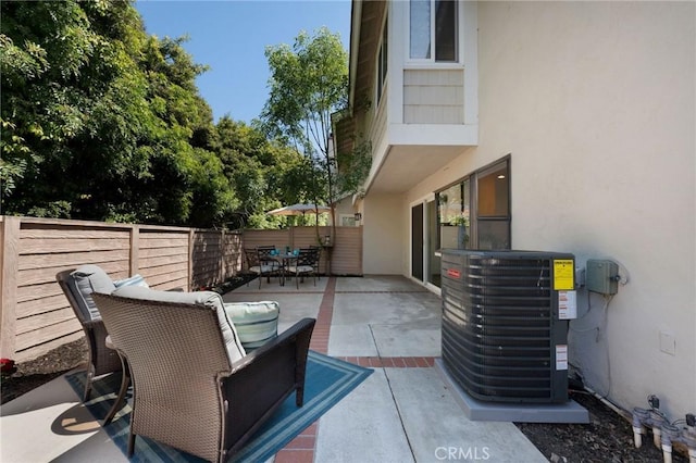 43 Ashbrook, Irvine, CA 92604 - view of patio / terrace featuring a fenced backyard, outdoor dining area, and central AC