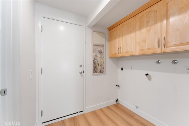 43 Ashbrook, Irvine, CA 92604 - clothes washing area with baseboards, light wood-style floors, gas dryer hookup, hookup for an electric dryer, and cabinet space