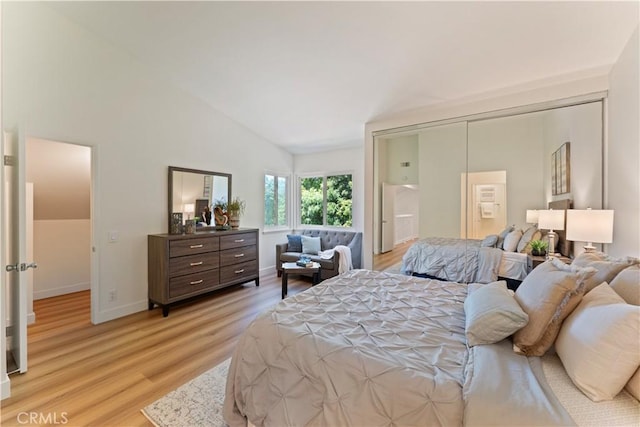 43 Ashbrook, Irvine, CA 92604 - bedroom with high vaulted ceiling, light wood finished floors, and baseboards