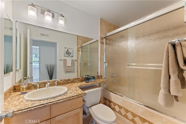 43 Ashbrook, Irvine, CA 92604 - full bathroom with a shower with shower door, vanity, visible vents, and toilet