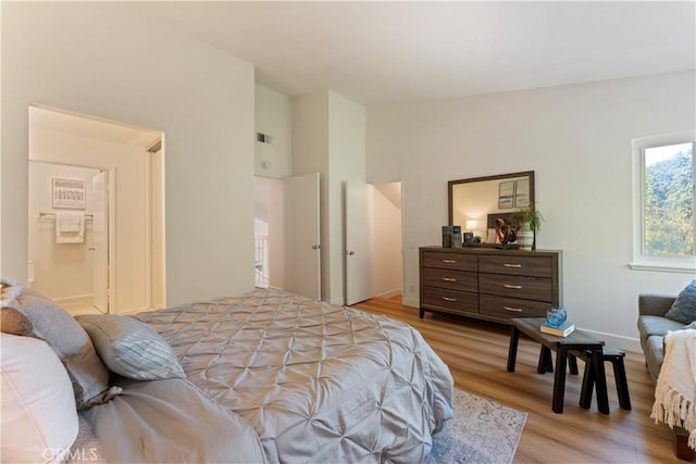 43 Ashbrook, Irvine, CA 92604 - bedroom with visible vents, light wood-type flooring, and lofted ceiling