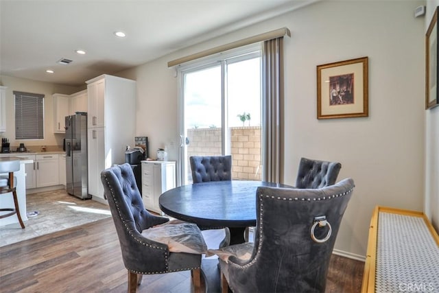 dining area featuring visible vents, baseboards, recessed lighting, and light wood-style floors