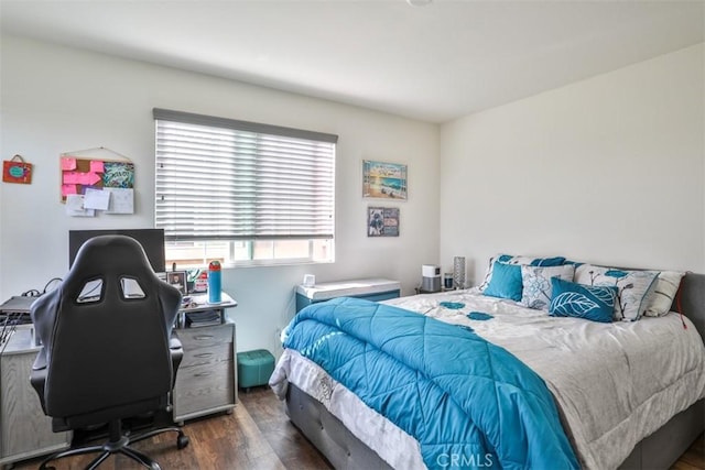 bedroom with wood finished floors