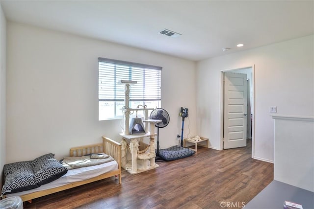 workout area featuring visible vents, recessed lighting, and wood finished floors