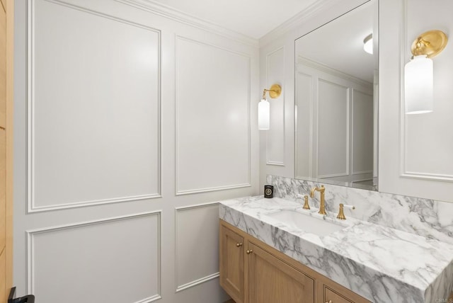 bathroom with a decorative wall and vanity