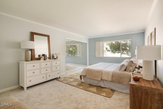 bedroom featuring crown molding, baseboards, and light carpet